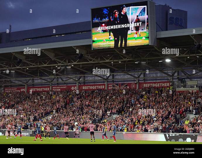 a-tribute-to-brentford-technical-director-robert-rowan-on-the-big-screen-during-the-premier-league-match-at-the-brentford-community-stadium-london-picture-date-friday-august-13-2021-2GDJBRX