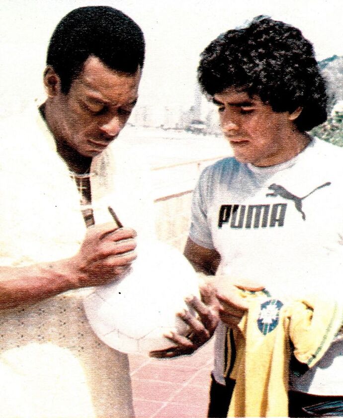 Pele_signing_ball_maradona